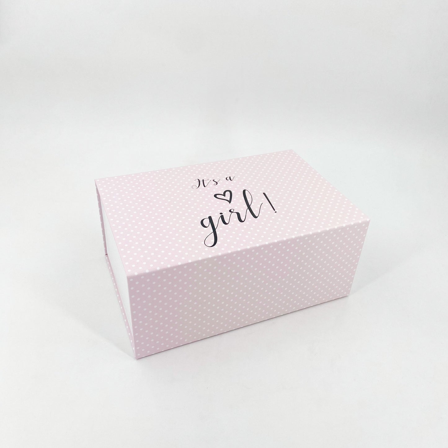 Rosa Magnetschachteln mit weißen Punkten mit der Aufschrift "Its a girl"