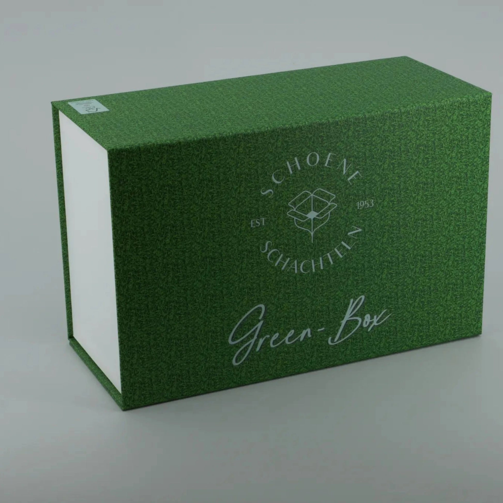 Grüne Geschenkbox mit strukturierter Oberfläche und Logo „Schöne Schachteln“, hochwertige Präsentationsbox für besondere Anlässe